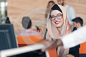 Young Arabic business woman wearing hijab,working in her startup office.