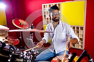 Young arabic man in a professional recording studio