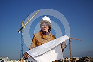Young architect in front of construction site