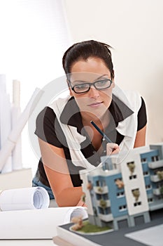 Young architect with glasses working