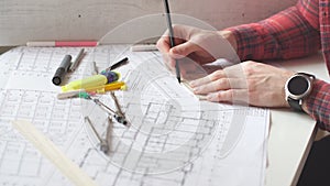 Young architect working in the office.