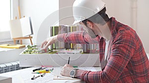 Young architect working in the office.