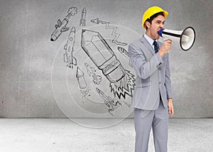 Young architect yelling with a megaphone