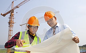 Young architects discussion in front of construction site