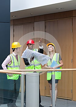 Young architects studying a building