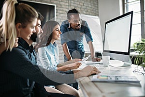 Young architects working on project in office