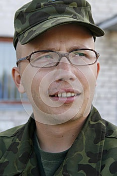 Young army cadet with glasses