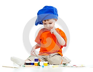 Young artist child with paints