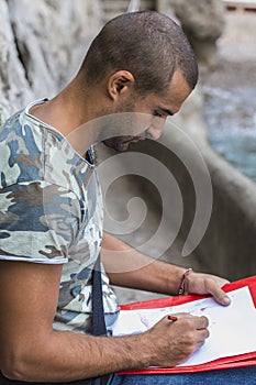 Young artist while drawing