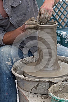Young artist shaping a clay pot 2