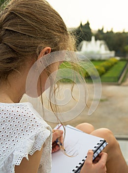 Young artist sketching.