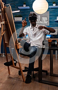 Young artist wearing virtual reality headset imagining draw sketch