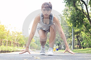 Young Asain woman preparing to run.Wellness healthy and lifestyle concept