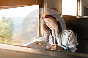 Young Asia backpacker woman travels by train