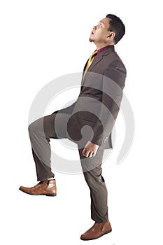 Young Asia Businessman Walking, Stepping Up, Side View