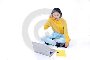 Young asia girl sitdown with notebook and laptop with white background