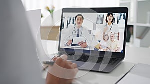 Young Asia lady doctor in white medical uniform with stethoscope using computer laptop talking video conference call with patient