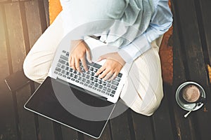 Young asia muslim woman work out office chill on green nature pa