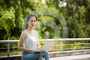 Young Asia woman working with laptop computer, happy and success for businesswoman concept