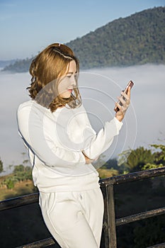 Young asia women use telephone conection photo