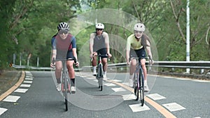 young asian adult cyclists riding bike