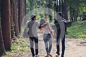 Young Asian - African tourists to travel in the forest,Summer jo