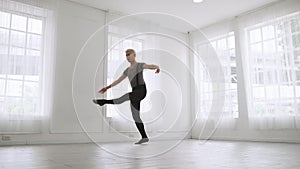 Young Asian ballet dancer practicing in a room alone.