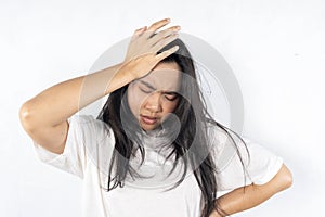 Young asian beautiful woman hand touching head she's feeling depressed stress headache