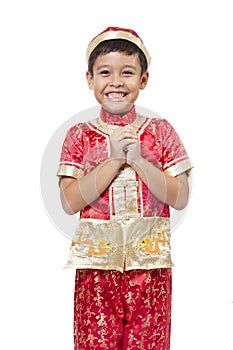 Young Asian boy with Chinese traditional outfit cheongsam or tan