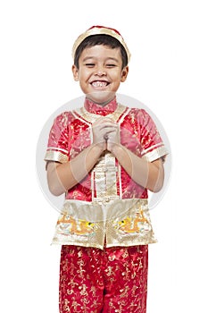 Young Asian boy with Chinese traditional outfit cheongsam or tan