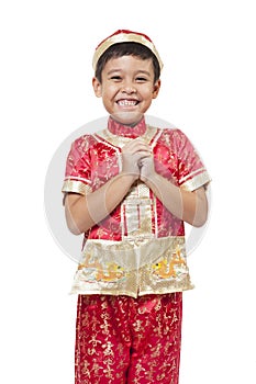 Young Asian boy with Chinese traditional outfit cheongsam or tan