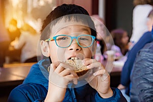 Boy eating sandwich for lunch