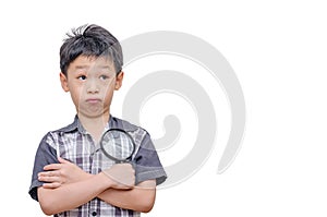 Young Asian boy holding magnifying glass and thinking