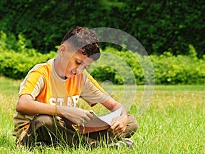 Young asian boy studying