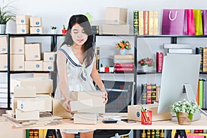 Young Asian business lady at office