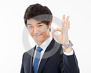 Young Asian business man showing okay sign