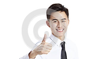 Young asian business man showing thumb-up sign