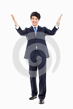 Young Asian business man showing welcom sign.