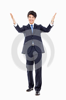 Young Asian business man showing welcom sign. photo