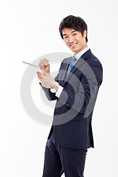 Young Asian business man using a pad PC