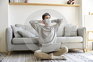 Young asian business man wearing mask working at home