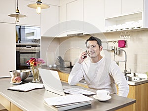 Young asian business man working from home