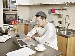 Young asian business man working from home