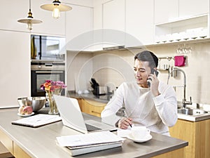 Young asian business man working from home