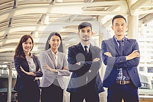 The young Asian business team stands with confidence and pride. photo