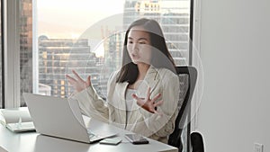 Young Asian business woman communicating by video conference call meeting.