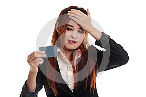 Young Asian business woman headache with a blank card.