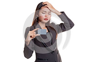 Young Asian business woman headache with a blank card.
