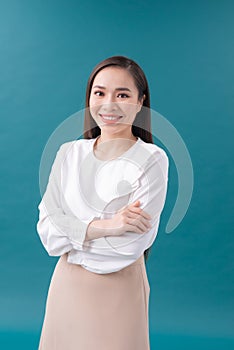 Young asian business woman isolated on blue background