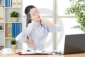 Young asian business woman with pain in neck